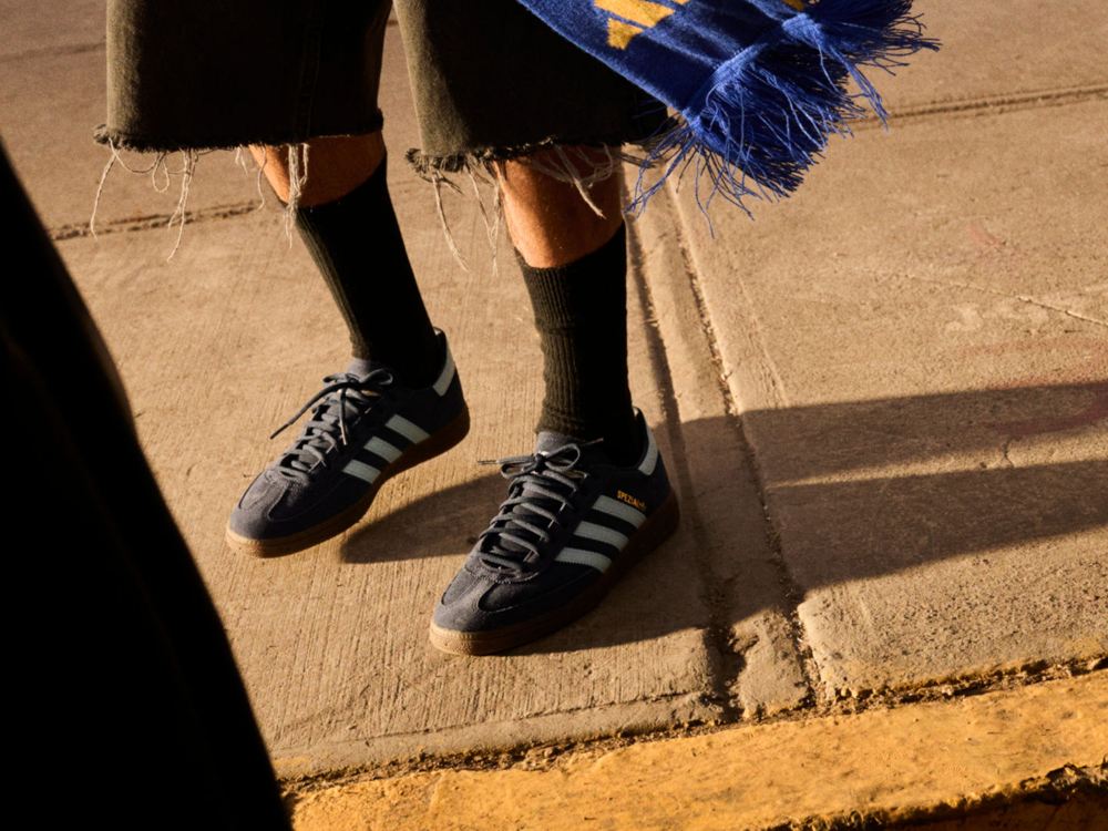 adidas Handball Spezial trainers worn with black socks and cropped trousers in the sunshine